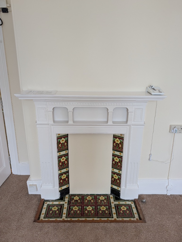 Original fireplace and decorative details at Treveor House